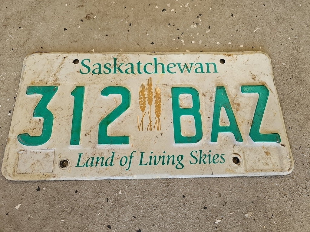 Saskatchewan Canada License Plate #799 JTY Wheat Sheaf Sheaves EXPIRED Aluminum 