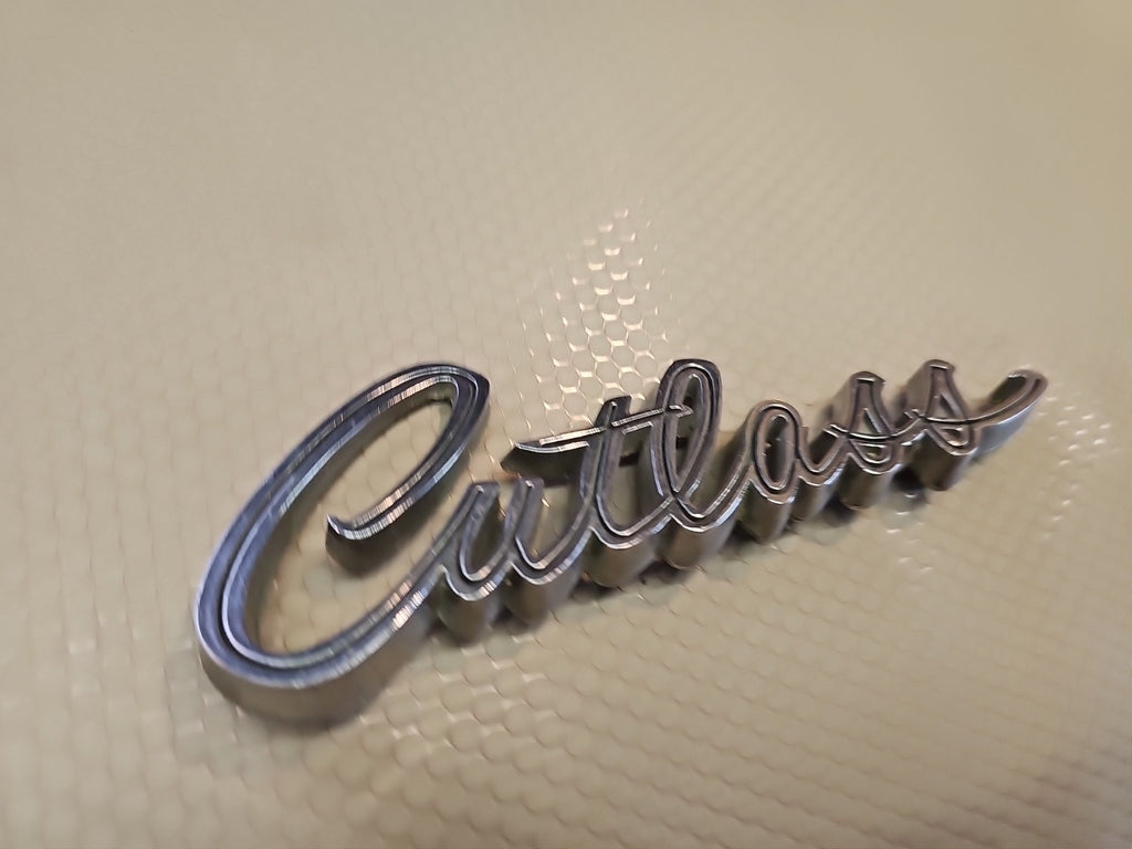 Original 1969 Oldsmobile Cutlass script emblem 399503 - Vintage OEM Badge